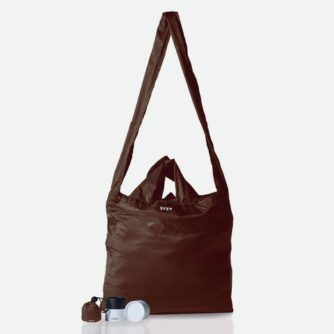 SYZY Tetra Tote Bag in burnt umber colour with both shoulder and hand strap available with the size comparison when its shrink into micro size