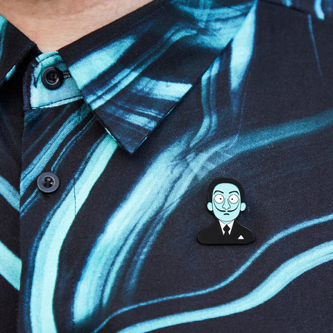 A model proudly wears a enamel pin from Chatty Feet featuring Salvador Dali