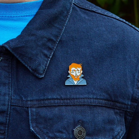 A model proudly wears a enamel pin from Chatty Feet featuring Vincent Van Gogh