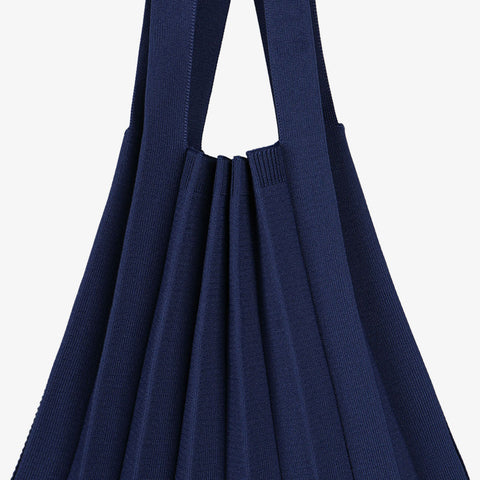 Pleatsmama Shoulder Bag Solid in navy—captured in a clean close-up angle to highlight its rich texture and elegance