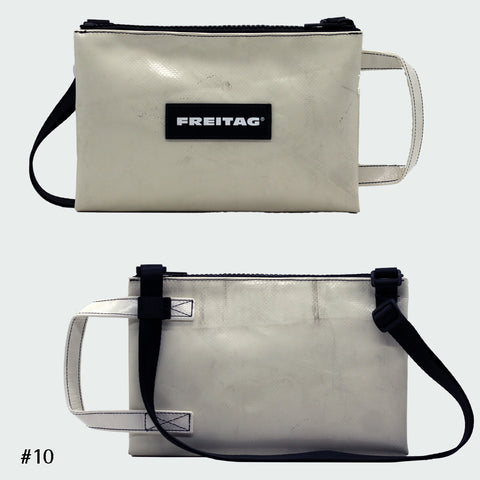 Front and back views of FREITAG F272 EDDIE crossbody bag, offwhite with offwhite handle and black strap.