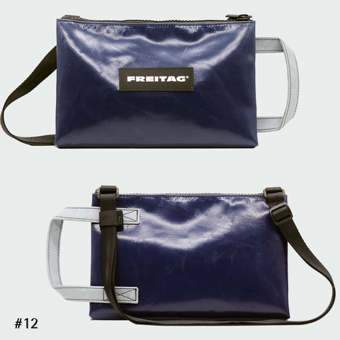 Front and back views of FREITAG F272 EDDIE crossbody bag, navy blue with grey handle and black strap.
