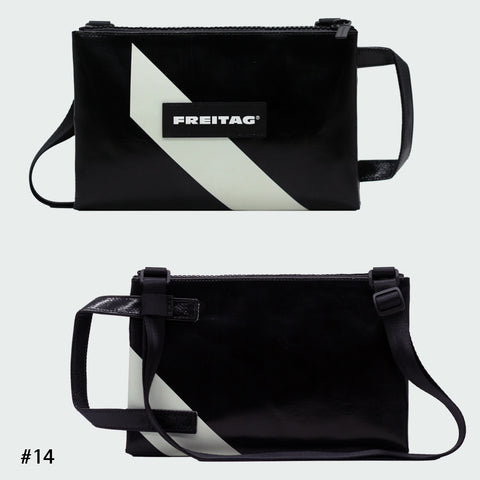 Front and back views of FREITAG F272 EDDIE crossbody bag, black and white with black handle and strap.