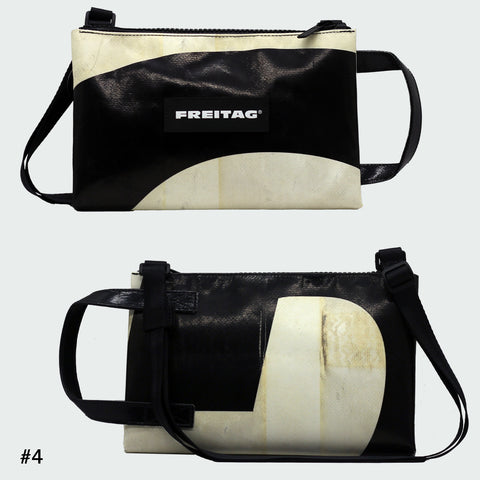 Front and back views of FREITAG F272 EDDIE crossbody bag, black and offwhite with black handle and strap.