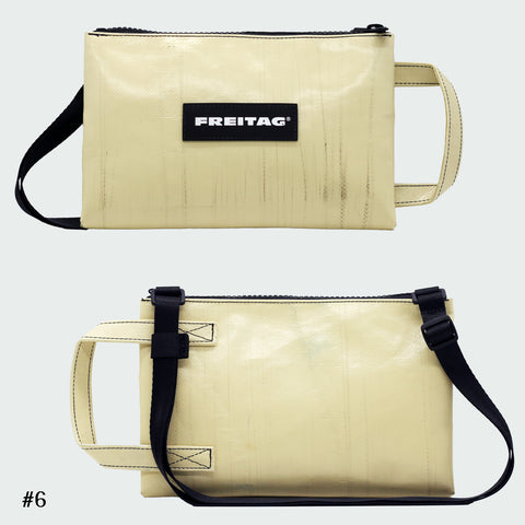 Front and back views of FREITAG F272 EDDIE crossbody bag, offwhite with offwhite handle and black strap.