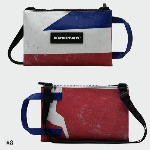 Front and back views of FREITAG F272 EDDIE crossbody bag, pink, blue and white with blue handle and black strap.