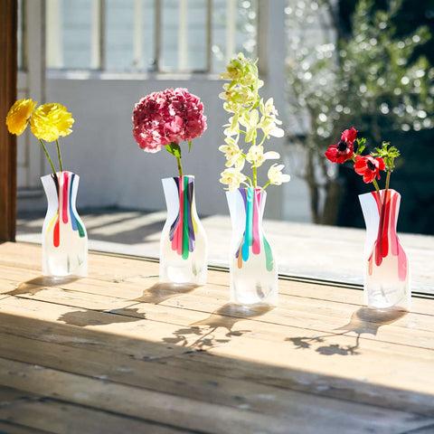 4 Colour drops flower vase showing the beauty of the refraction of light when the vase is filled with water at an outdoor setting