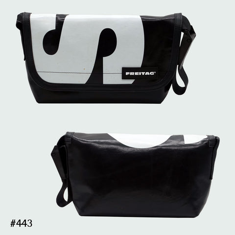 FREITAG F41 Hawaii Five-O messenger bag in black with bold white graphic, upcycled truck tarp, front and back views.