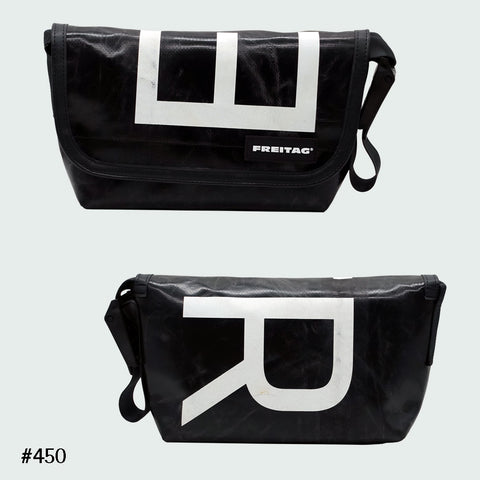 FREITAG F41 Hawaii Five-O messenger bag in black with bold white letter graphic, upcycled truck tarp, front and back views.