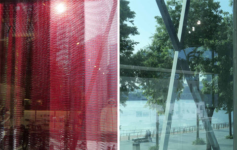 Red Mesh from the museum entrance and reflective glass showing Marina Bay