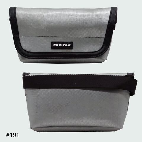 FREITAG F40 Jamie hip bag in solid grey, upcycled truck tarp belt bag with adjustable strap, front and back views.