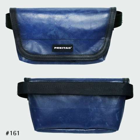 FREITAG F153 JAMIE hipbag with a weathered glossy navy blue tarp design