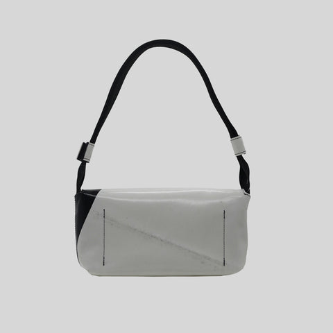 Back view of FREITAG F171 LAURA shoulder bag, white and black with black strap.