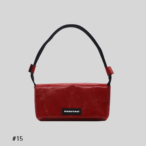 Front view of FREITAG F171 LAURA shoulder bag, red with black strap.