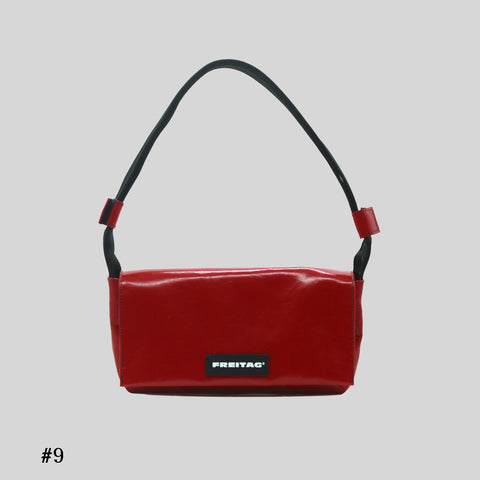 Front view of FREITAG F171 LAURA shoulder bag, red with black strap.