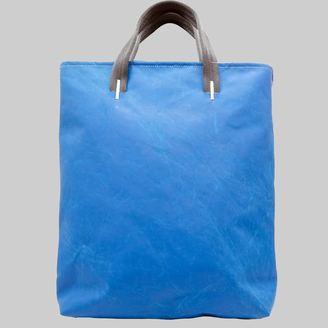 Freitag F202 LELAND tote bag back view with plain weathered blue tarp design