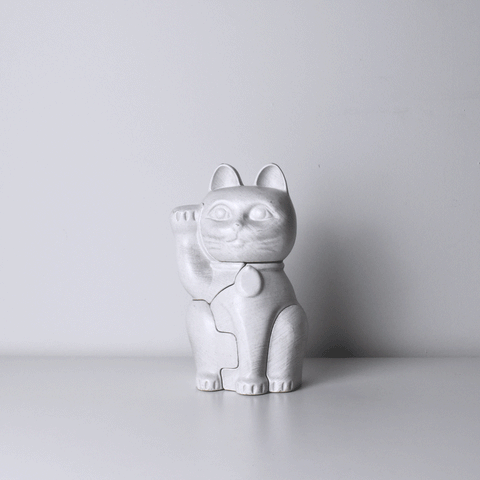 A gif showing Locknester Maneki-neko 3D printed puzzle piece together