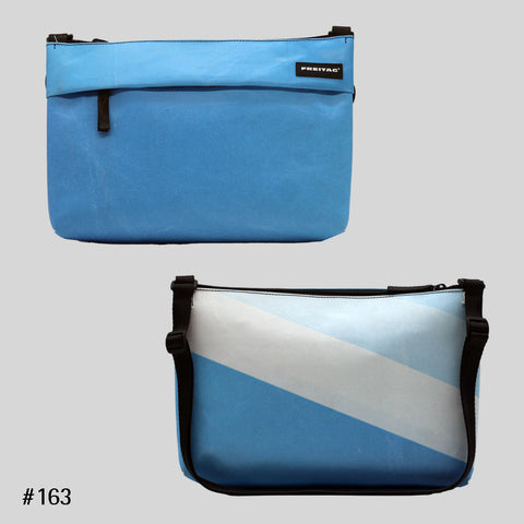 FREITAG F553 LOU shoulder bag in light blue with diagonal stripe, upcycled truck tarp crossbody, front and back views.