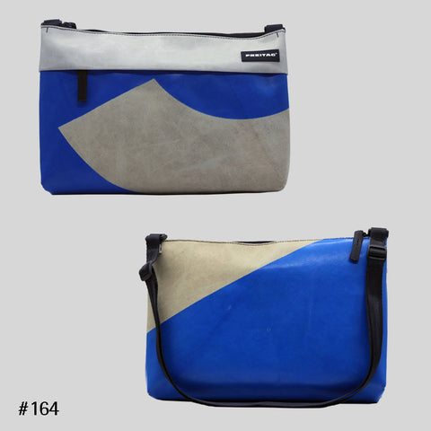 FREITAG F553 LOU shoulder bag in blue and grey colorblock, upcycled truck tarp crossbody, front and back views.