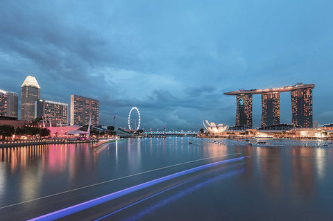Marina Bay evening skyline, with a light up marina bay sand, Singapore flyer as backdrop