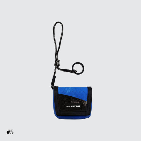 Front view of FREITAG F213 Mini Messenger key holder in blue and black with nylon cord.