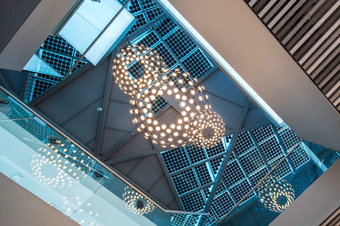 Luceplan Mesh lamp suspended beneath glass panels roof