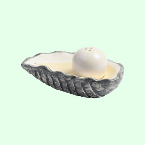 &Klevering Shell-shaped Oyster salt shaker on a light green background