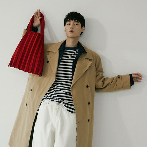 Pleatsmama Shoulder Bag Solid in red, featuring soft textured pleats, styled effortlessly on the model for a chic, modern statement