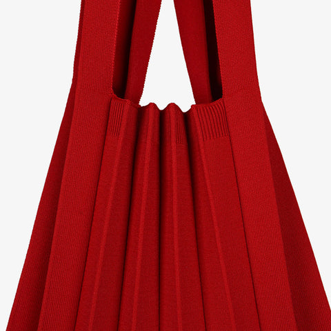 Pleatsmama Shoulder Bag Solid in red, with finely woven textured pleats, captured in a crisp close-up for a bold, luxurious look