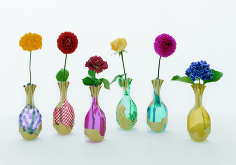 Flower Vase (Stripe and Blue) features sleek forms in vibrant hues—polka dots, stripes, gold accents, and bold blue tones, each has bright blooms