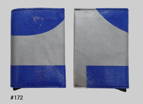 Front and back views of blue and silver FREITAG F705 SECRID Slimwallet RFID wallet with black stitching and a metal card slider at the base
