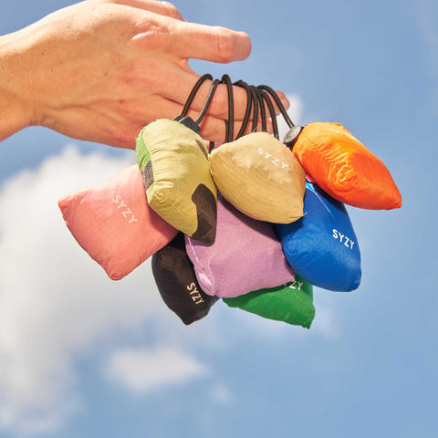 Tetra tote bag in micro pouch size with multiple colours in display