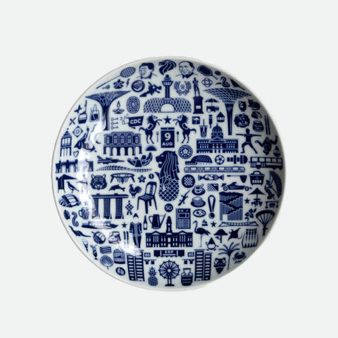 Supermama decorative plate with blue patterns on a white background showcasing singapore icons