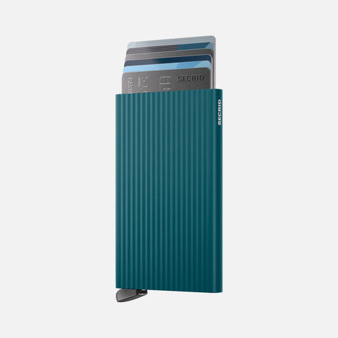SECRID Cardprotector Fluted-Teal with grooved finish, partially fanned cards, and easy-access lever in a slim, modern design