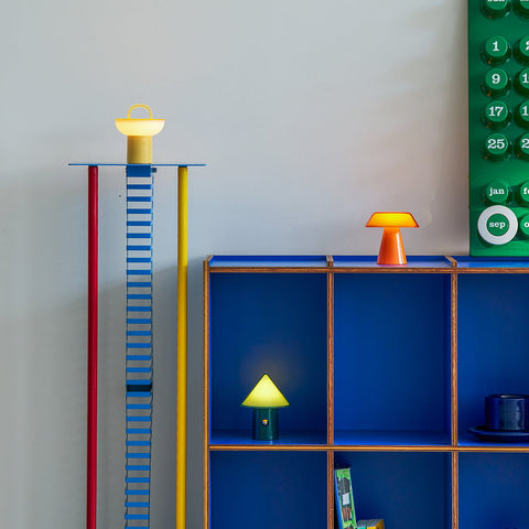 Lumena Space S mood lamps of yellow, green and orange with different light brightness place on a shelf setting