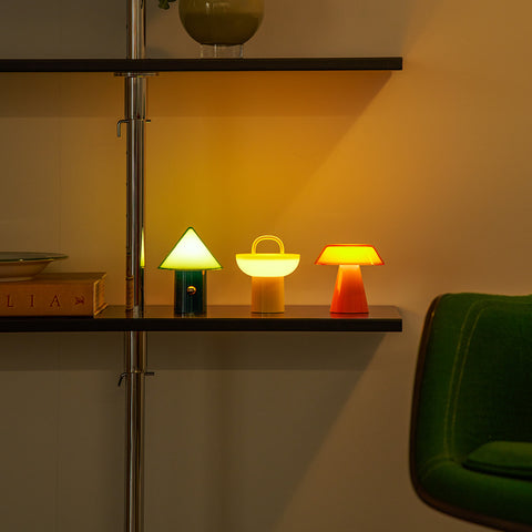 All 3 colours of Lumena Space S mood lamp using the warm light setting illuminating a indoor setting
