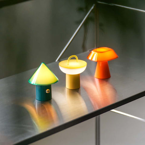 Lumena Space S mood lamp lighted up with vibrant warm lights in an outdoor setting