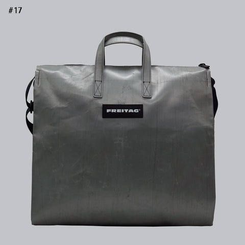 Front view of FREITAG F275 TILDA tote bag in silver, with silver handles and black shoulder strap