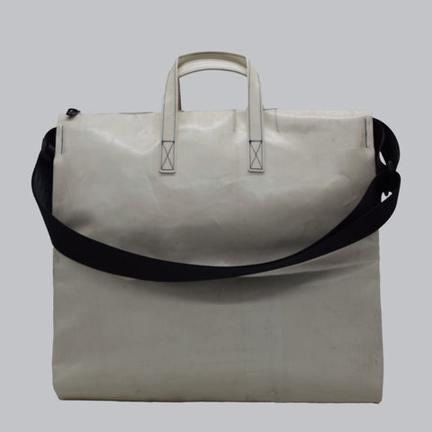 Back view of FREITAG F275 TILDA tote bag in white, with white handles, black shoulder strap.