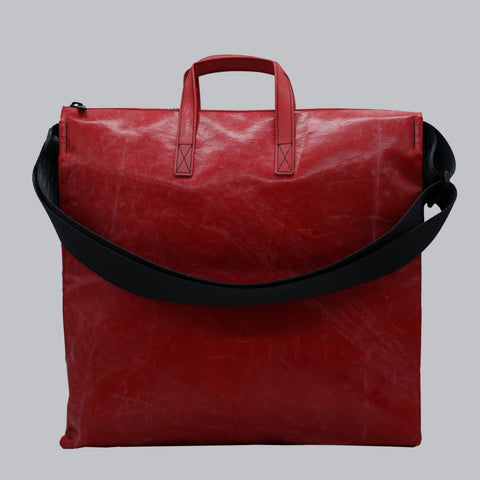 Back view of FREITAG F275 TILDA tote bag in red, with red handles, black shoulder strap.