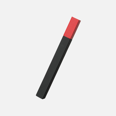 Tsubota Pearl two tone lighter with its slim cubed matchstick shape with a red top and black bottom