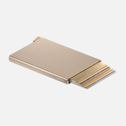 SECRID Cardprotector Fluted-Cashmere with cards extended, highlighting its slim profile, grooved texture, and smooth quick-access system