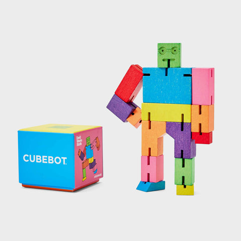 Areaware small Cubebot multicolour posing with its packaging box