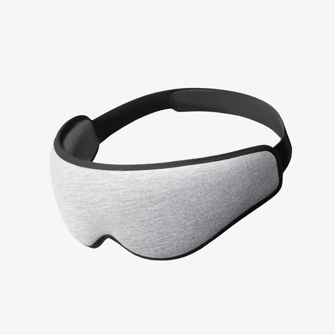 Ostrich Pillow Eye Mask in midnight grey, contoured sleep mask with adjustable strap, product shot on white background.