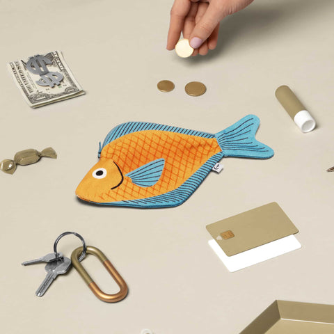 Don Fisher sea bream purse with a sea of keys, cards, sweets, cash, coins, limp bum, small items which can be fit into the purse