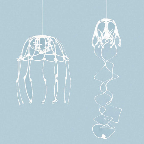 Full view of YURAYURA and KURUKURU Wind Jelly Fish Hangings by Fukunaga Print Co., Ltd against a light blue background.