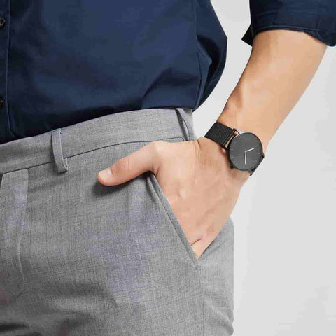 cropped view of man wearing Plain Supplies Signatur Black Watch in 40mm case size in black mesh strap