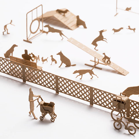 1/100 Architectural Model (People and Places)-No.67 Dog Run—warm beige cutouts with delicate, paper-like texture form a lively mini dog park scene