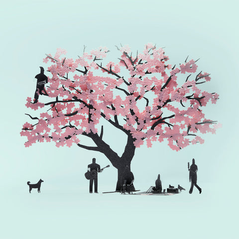 Fukunaga Print paper craft architectural model depicting a pink cherry blossom tree with people and animal in silhouette in a 1/100 scale