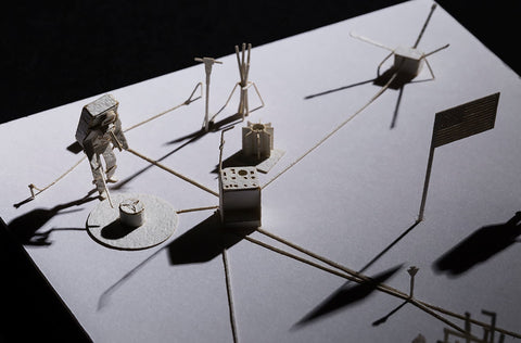 Close up view of architectural model featuring No.66 Lunar Roving Vehicle with spacecraft and astronaut in silhouette in a 1/100 scale